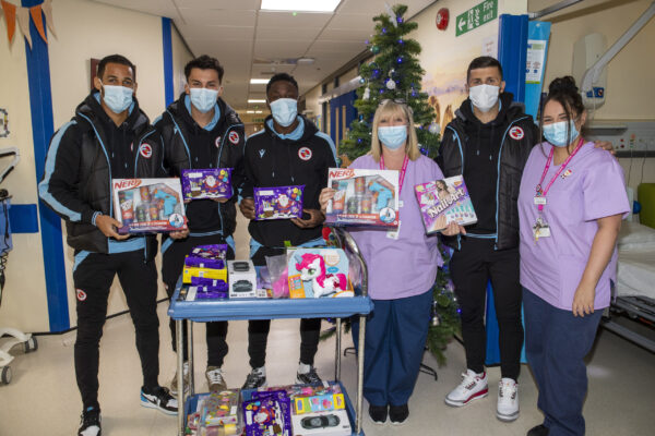 Reading FC players and staff hand out gifts while they visit the childrens ward at The Royal Berkshire Hospital in Reading.